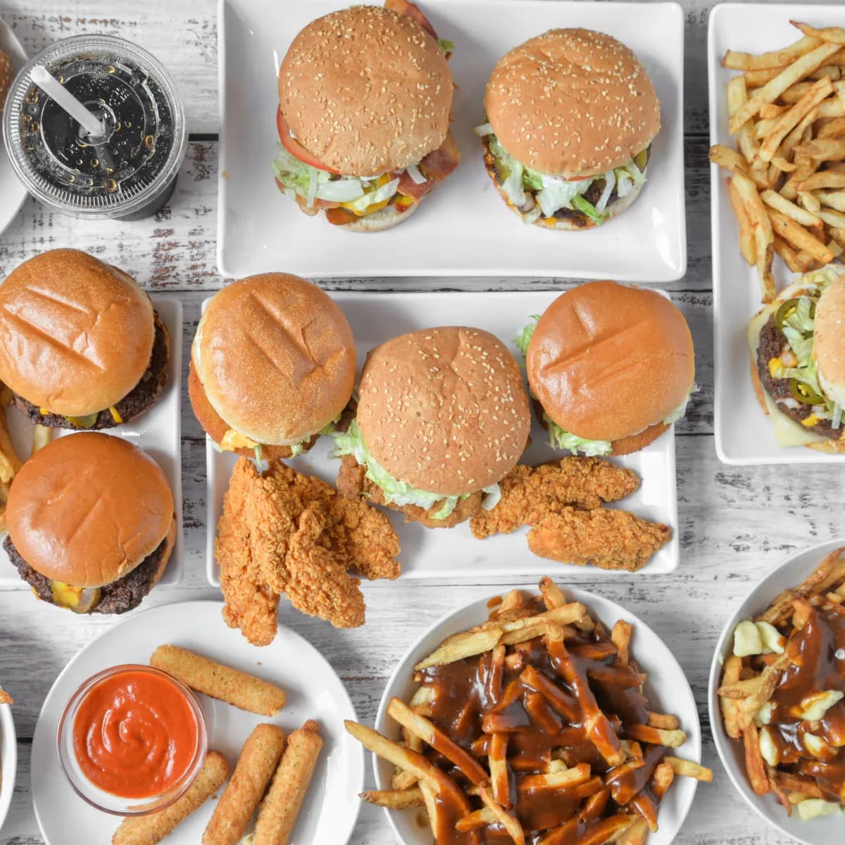 Junior's menu spread featuring Fat Boy burgers, poutine, fries, and chicken strips